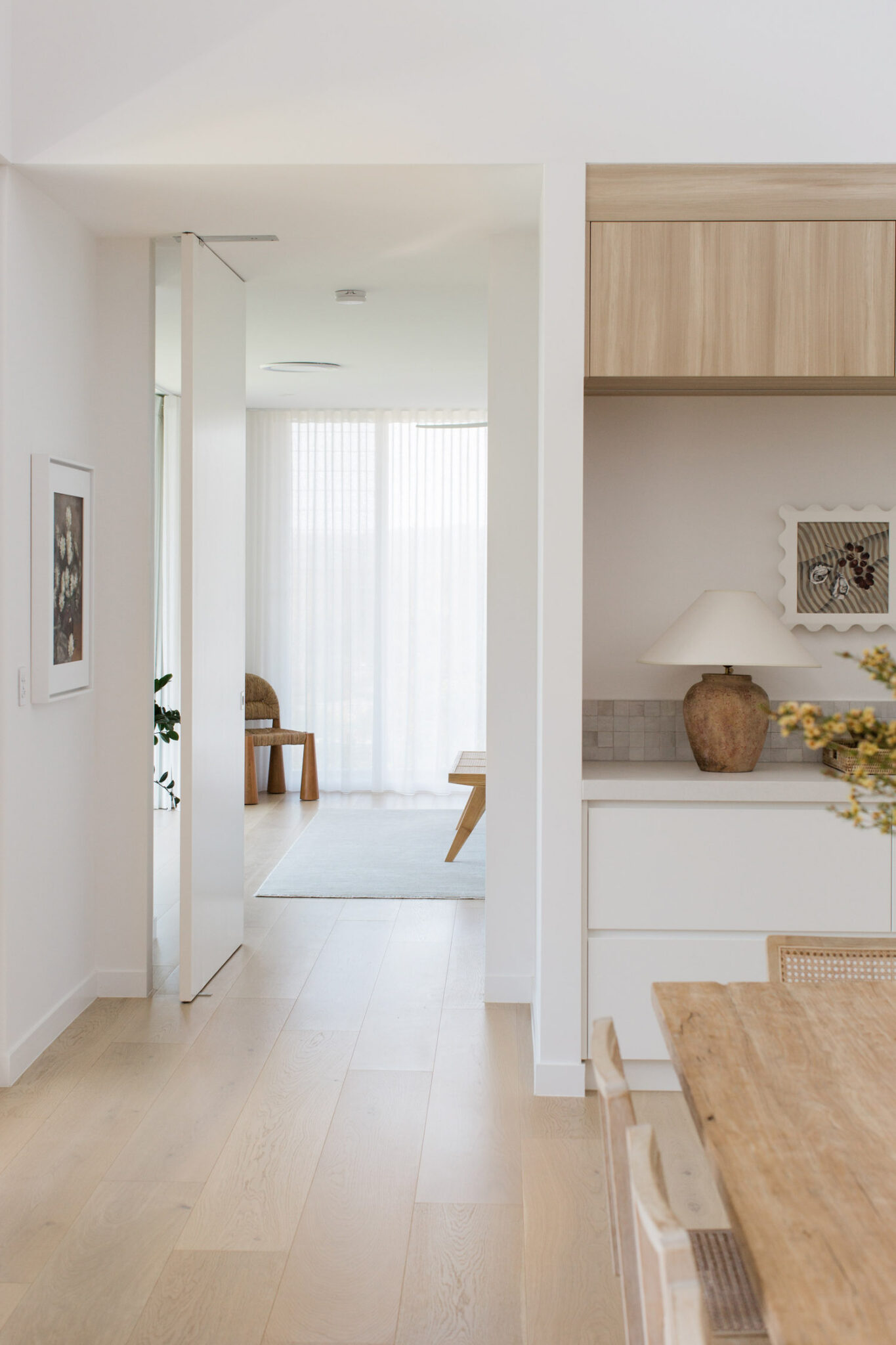 Looking through from a dining room to a bedroom.