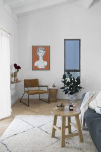 An eclectic living room with Moroccan rug.